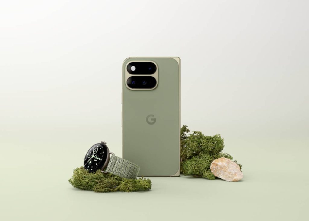 Olive Google Pixel 11 Pro Fold standing beside a Pixel Watch on green moss