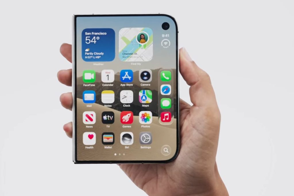 Closed iPhone Duo held in one hand showing apps and widgets on its 5.4-inch outer display